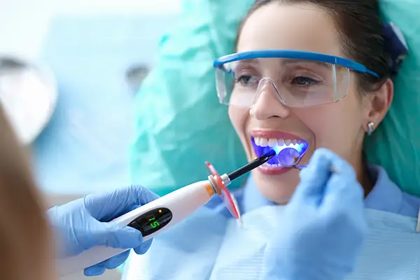 A woman receiving dental bonding treatment at Capitol Square Dental 