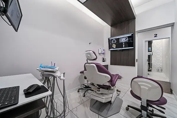 Exam room at Capitol Square Dental, chair and digital X-ray