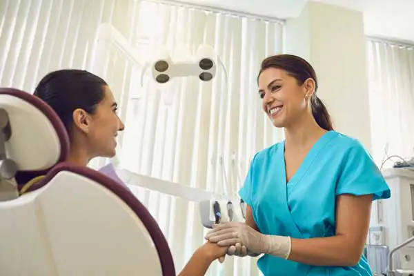 Woman talking to dentist about Dental Implants