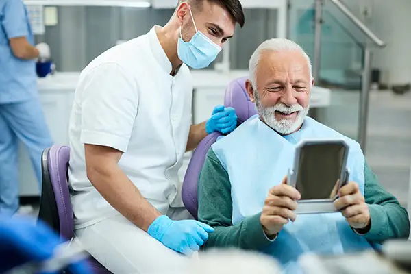 Man with dentures at Capitol Square Dental 